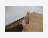 "Le manche comme resultant du fait d'avoir pris" - "The handle as a result of having taken", 2020-2025 - grass, clay 5 x 5 x 20 cm